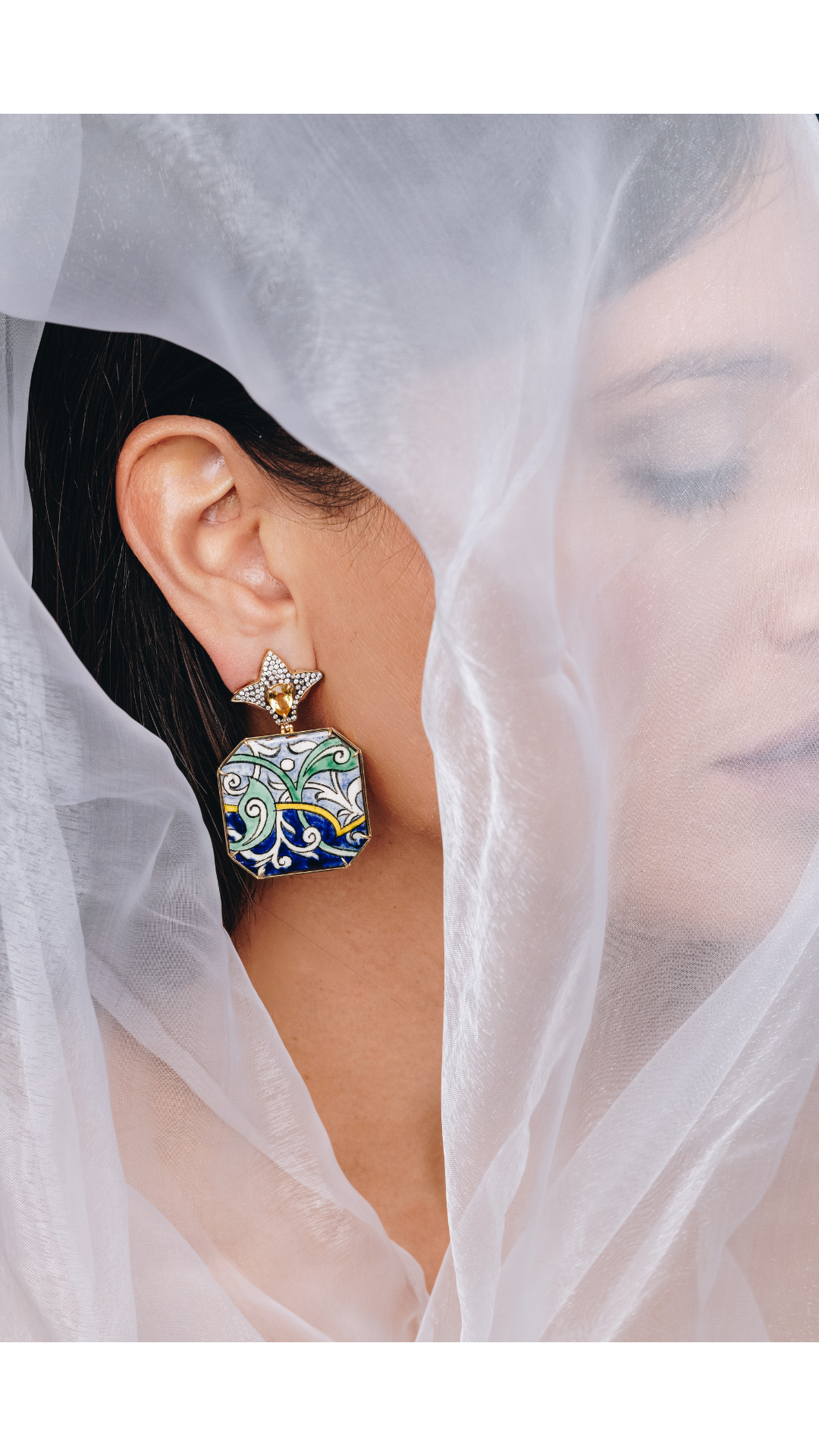 ear stacking with 2 cuffs and an Alex Sepkus hoop earring and a little windows stud