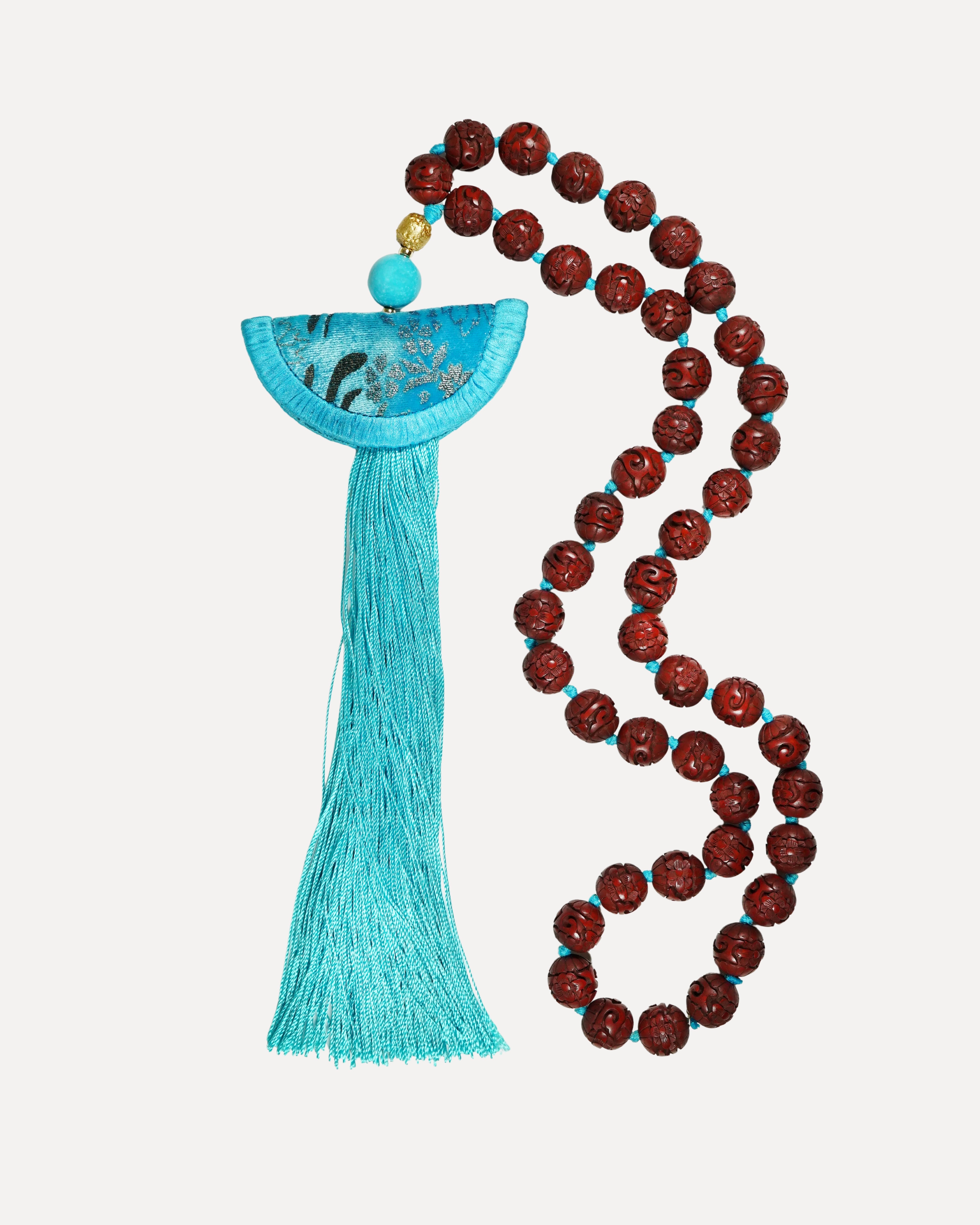 Turquoise Venetian silk necklace with half moon format, tassel and cinnabar