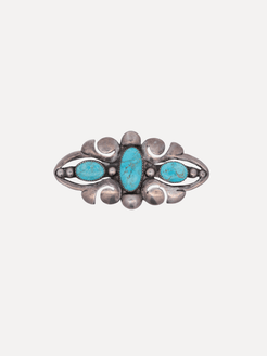 Silver ring with turquoise stones on a white background