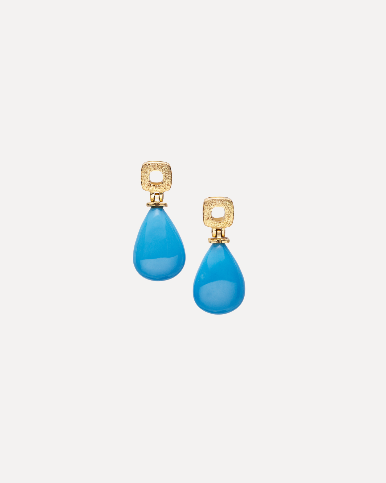 A pair of turquoise drop 18k gold post earrings by Alex Sepkus.