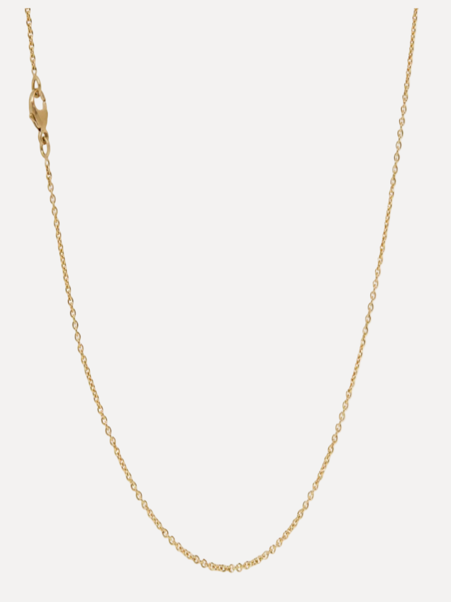 Gold chain necklace on a white background