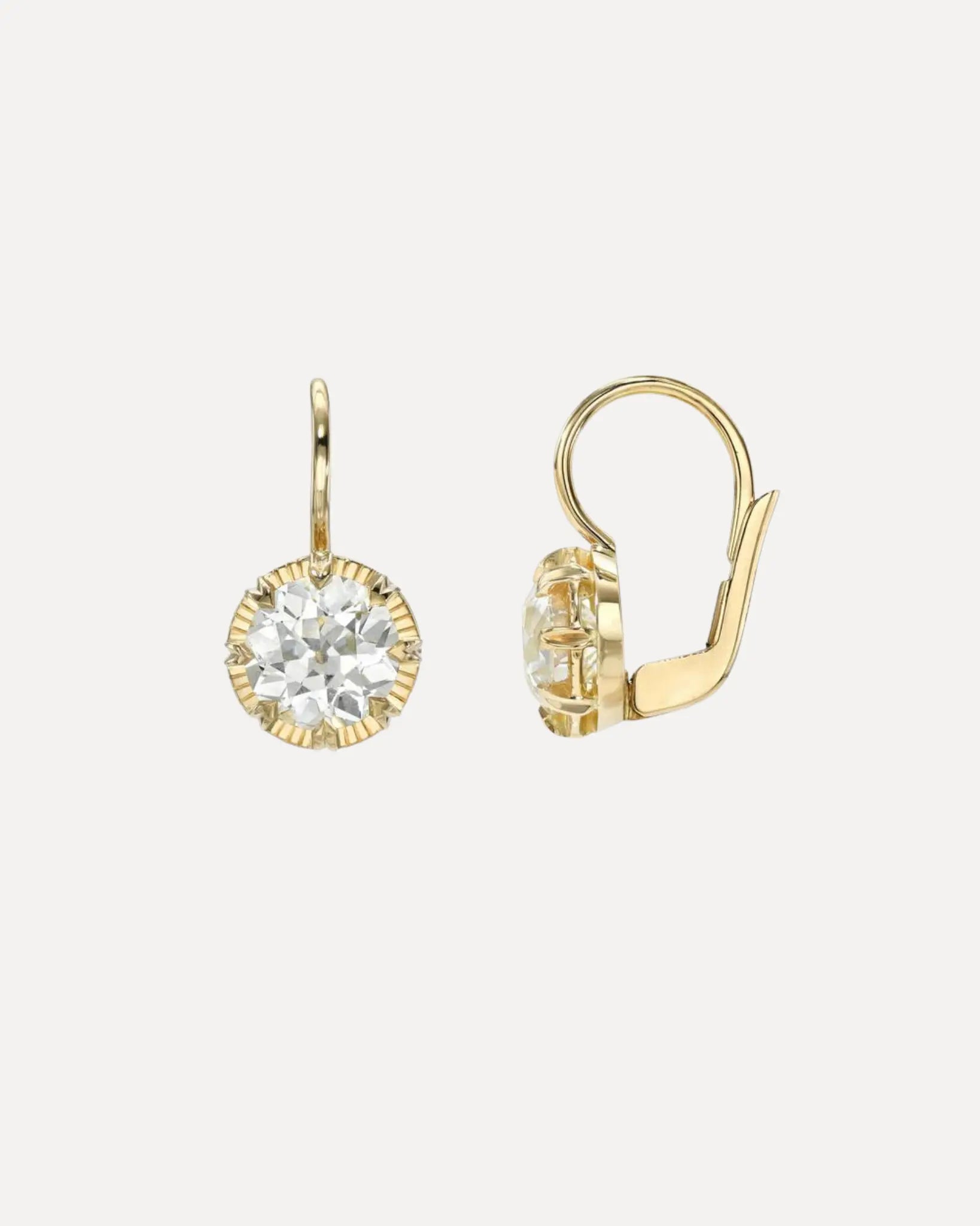 A pair of 18k yellow gold diamond drop earrings by Single Stone.