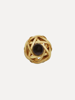 Gold ring with a central black pearl on a white background. Bamboo ring with black pearl ring