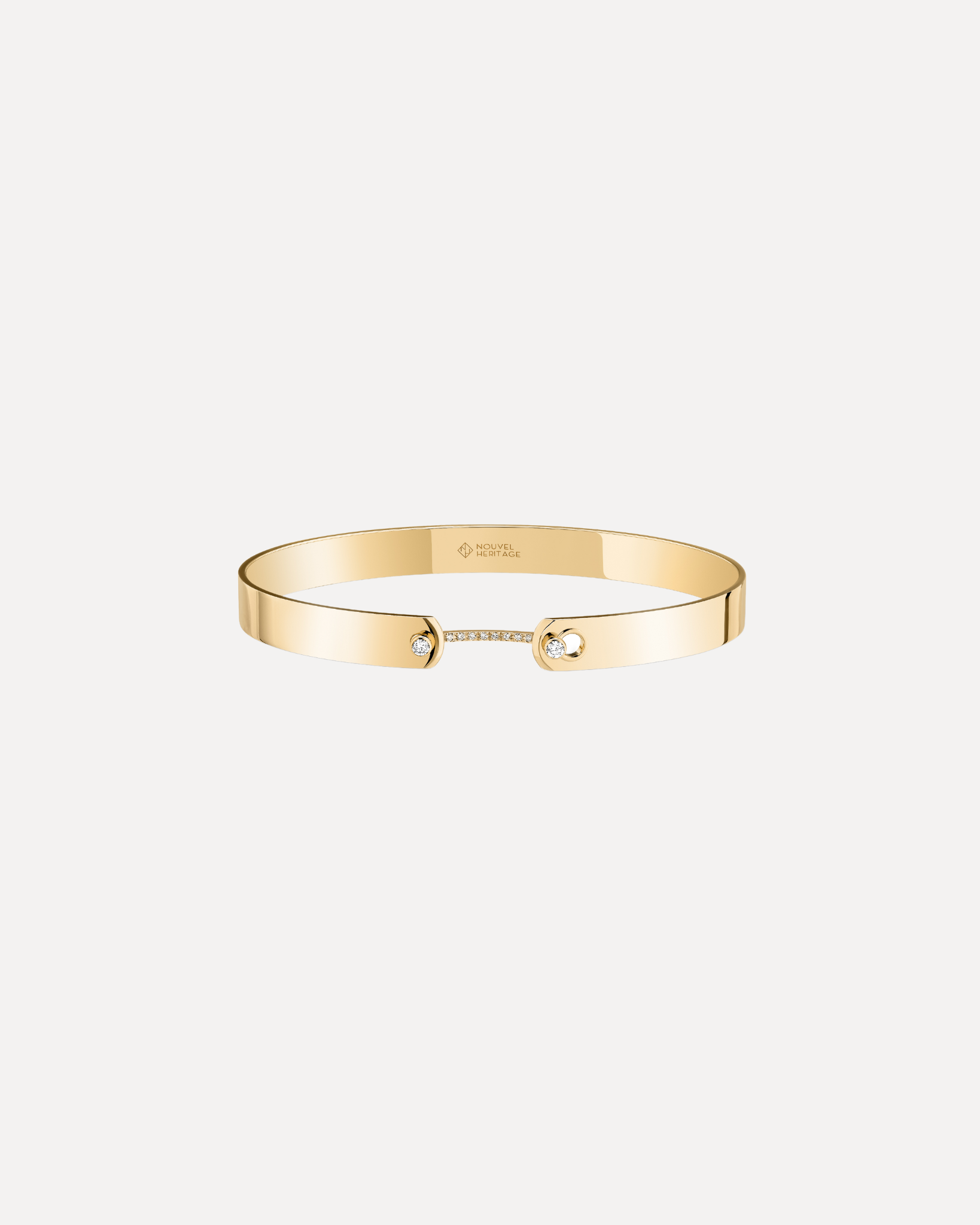 A ladies gold & diamond bangle bracelet by Nouvel Heritage