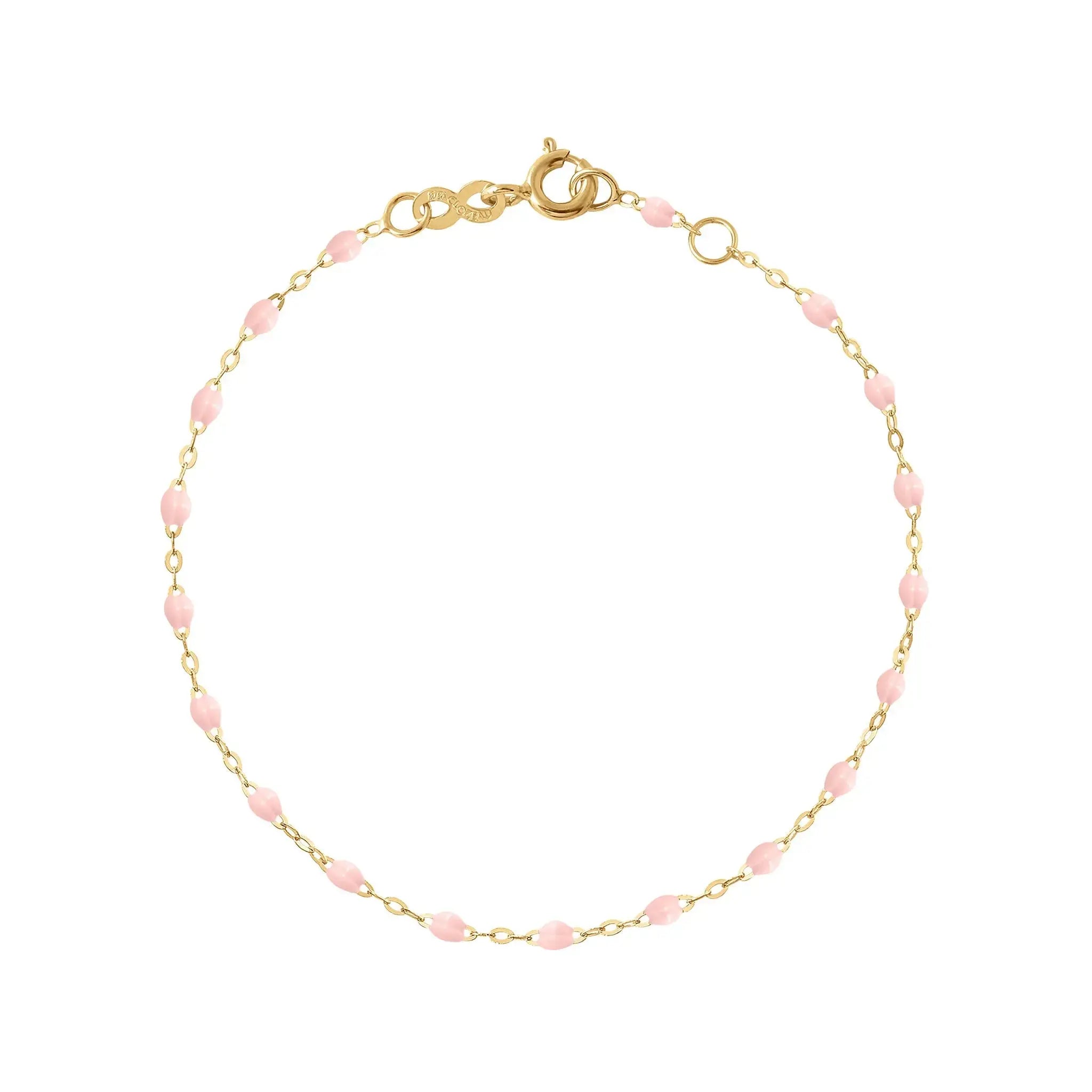 The Classic Gigi bracelet by gigi CLOZEAU features 18 carat Yellow Gold, and unique Baby Pink jewels for a simple, everyday look.   Each jewel is unique, artisanally made in their family-owned workshop. 18K yellow gold and resin. The bracelet measures 6.7 inches with adjustable clasp at 6.3 inches.