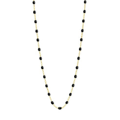 Stack you necklace layers with this versatile beaded chain! The Classic Gigi Necklace by gigi CLOZEAU features 18 carat yellow gold, and striking Black resin jewels for an everyday effortless appearance. Handcrafted in 18k yellow gold. The beads measure 1.50mm in diameter and is finished with a spring ring clasp. The length is 19.7 inches.