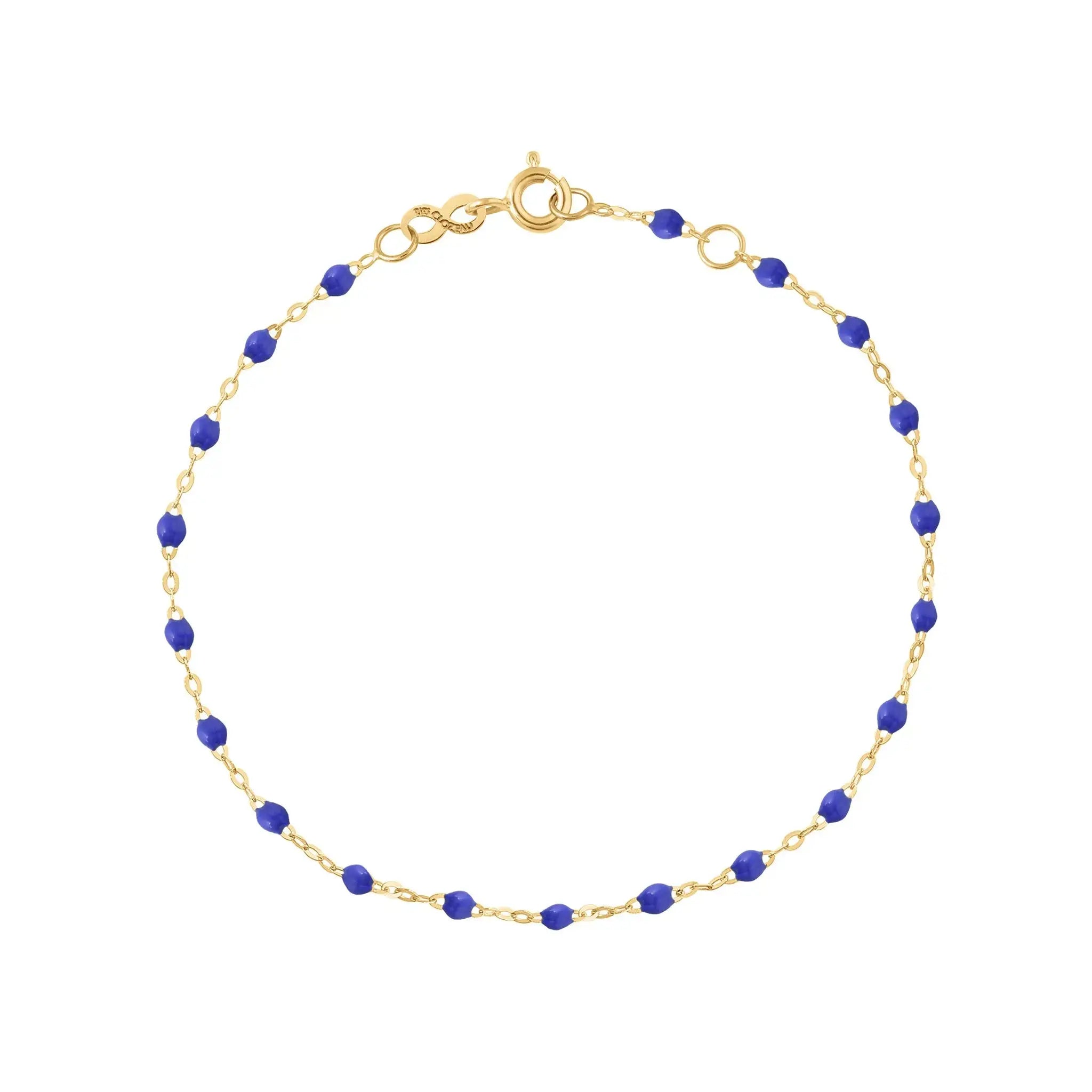 The Classic Gigi bracelet by gigi CLOZEAU features 18K Yellow Gold, and unique Bleuet jewels for a simple, everyday look.   Each jewel is unique, artisanally made in their family-owned workshop. 18K yellow gold and resin. The bracelet measures 6.7 inches with adjustable clasp at 6.3 inches.