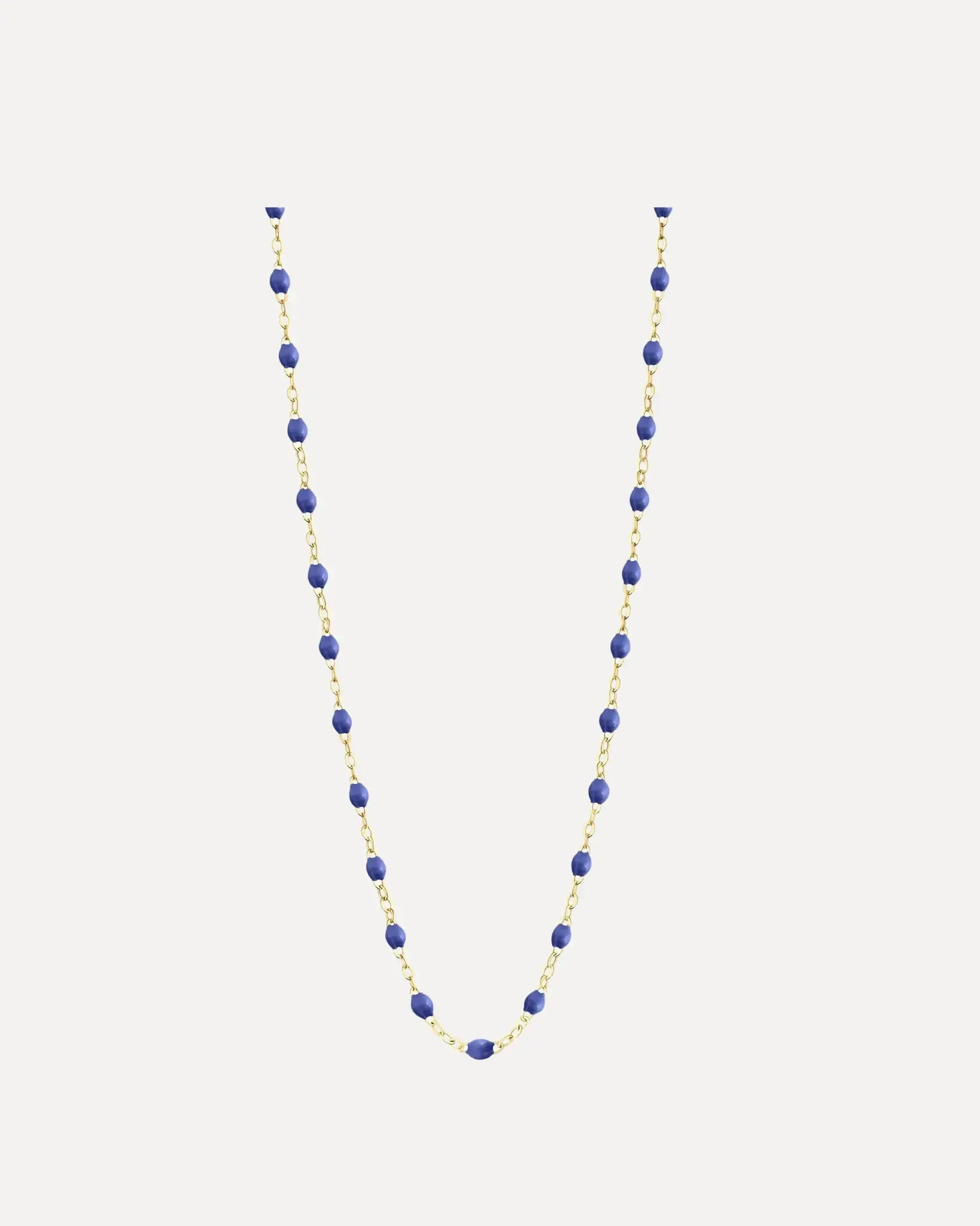 Necklace with blue beads on a white background