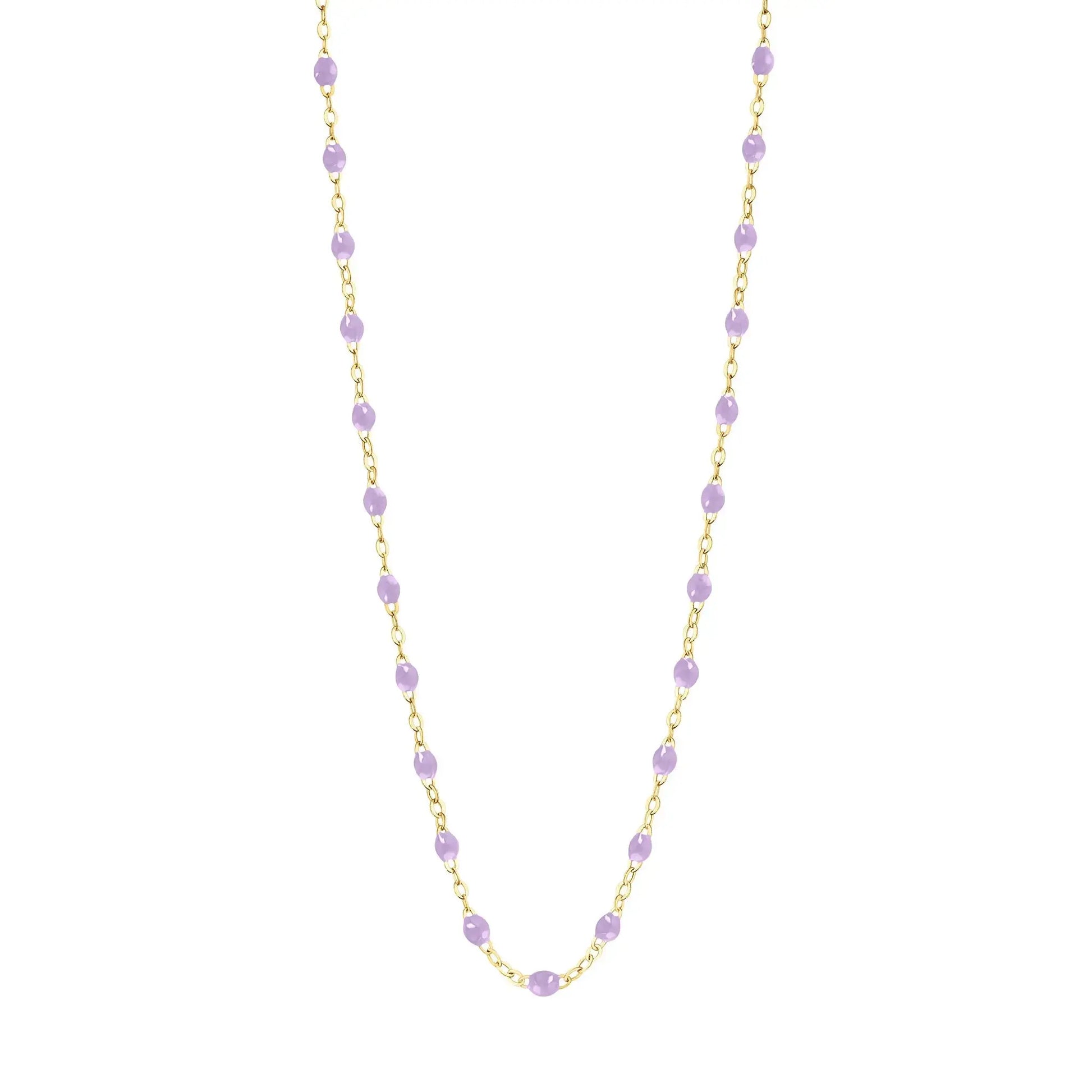 Stack you necklace layers with this versatile beaded chain! The Classic Gigi Necklace by gigi CLOZEAU features 18 carat yellow gold, and striking Lilac resin jewels for an everyday effortless appearance. Handcrafted in 18k yellow gold. The beads measure 1.50mm in diameter and is finished with a spring ring clasp. The length is 16.5 inches.