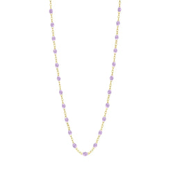 Stack you necklace layers with this versatile beaded chain! The Classic Gigi Necklace by gigi CLOZEAU features 18 carat yellow gold, and striking Lilac resin jewels for an everyday effortless appearance. Handcrafted in 18k yellow gold. The beads measure 1.50mm in diameter and is finished with a spring ring clasp. The length is 16.5 inches.