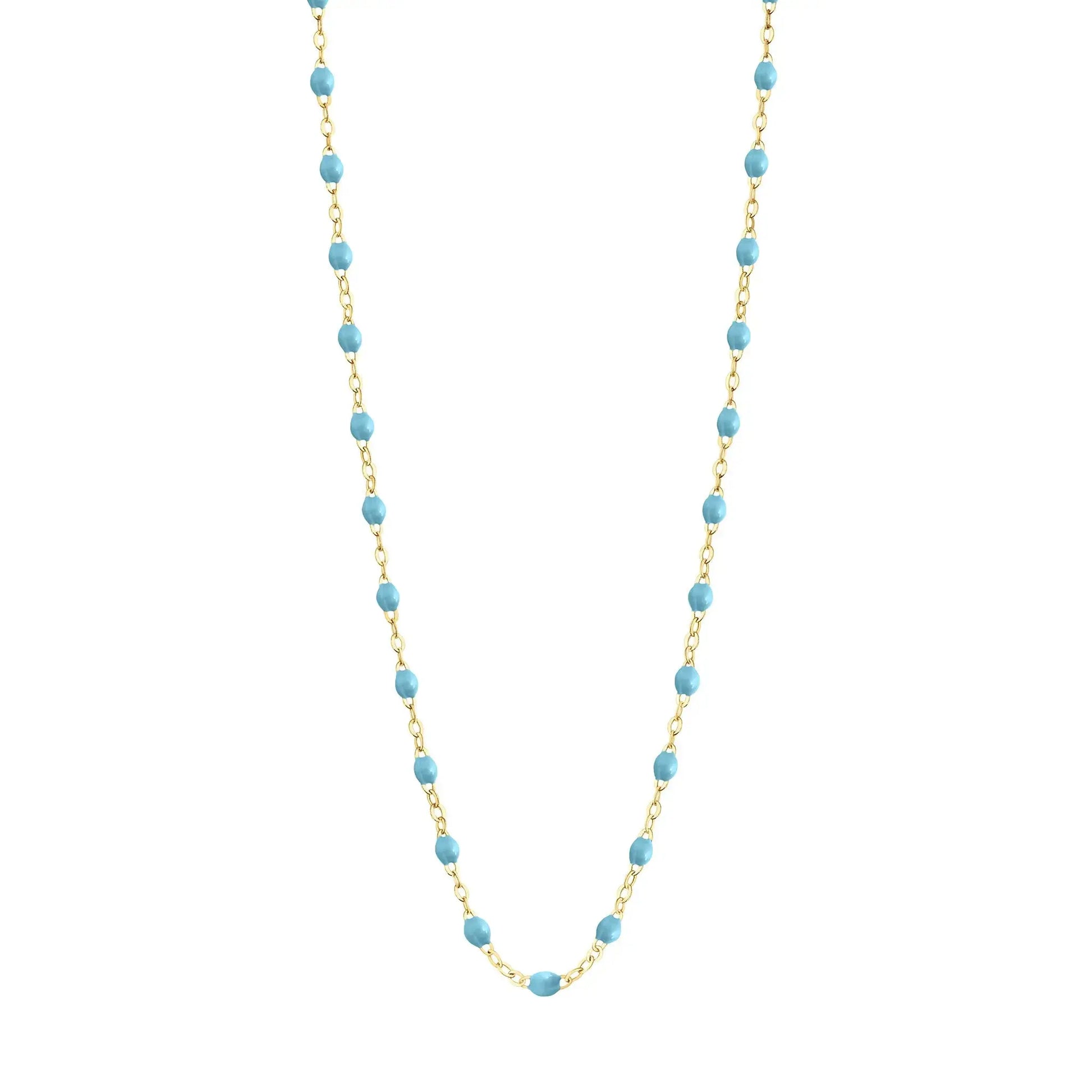 Stack you necklace layers with this versatile beaded chain! The Classic Gigi Necklace by gigi CLOZEAU features 18 carat yellow gold, and striking Turquoise resin jewels for an everyday effortless appearance. Handcrafted in 18k yellow gold. The beads measure 1.50mm in diameter and is finished with a spring ring clasp. The length is 19.7 inches.