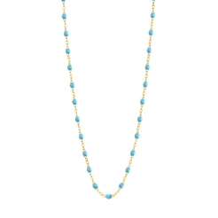 Stack you necklace layers with this versatile beaded chain! The Classic Gigi Necklace by gigi CLOZEAU features 18 carat yellow gold, and striking Turquoise resin jewels for an everyday effortless appearance. Handcrafted in 18k yellow gold. The beads measure 1.50mm in diameter and is finished with a spring ring clasp. The length is 19.7 inches.
