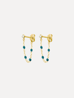 Gold earrings with teal beads on a white background