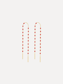 Pair of red beaded earrings on a white background