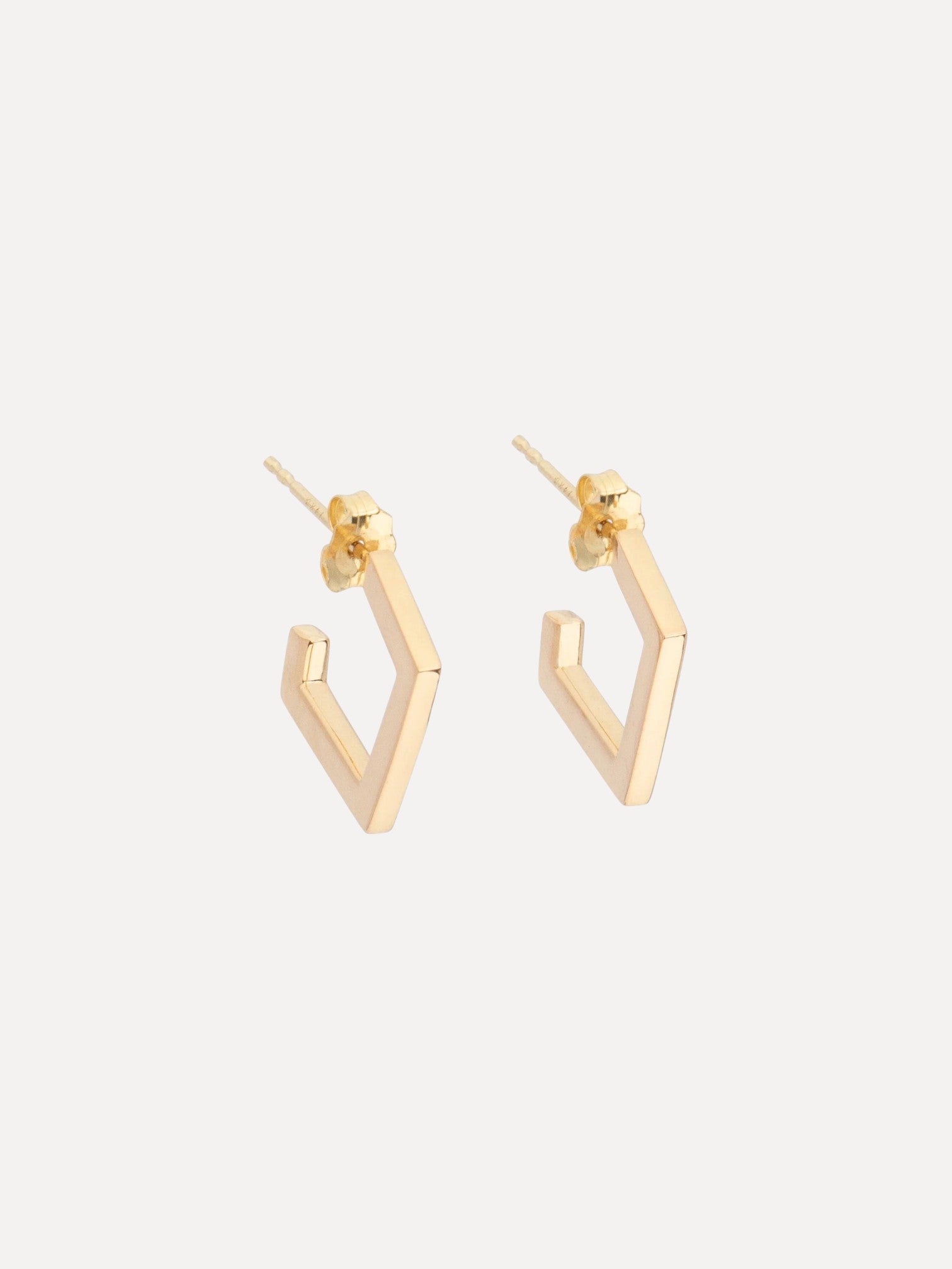 Gold hoop earrings on a white background