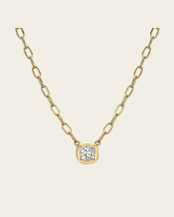 A Cori chain link gold chain with a diamond pendant.