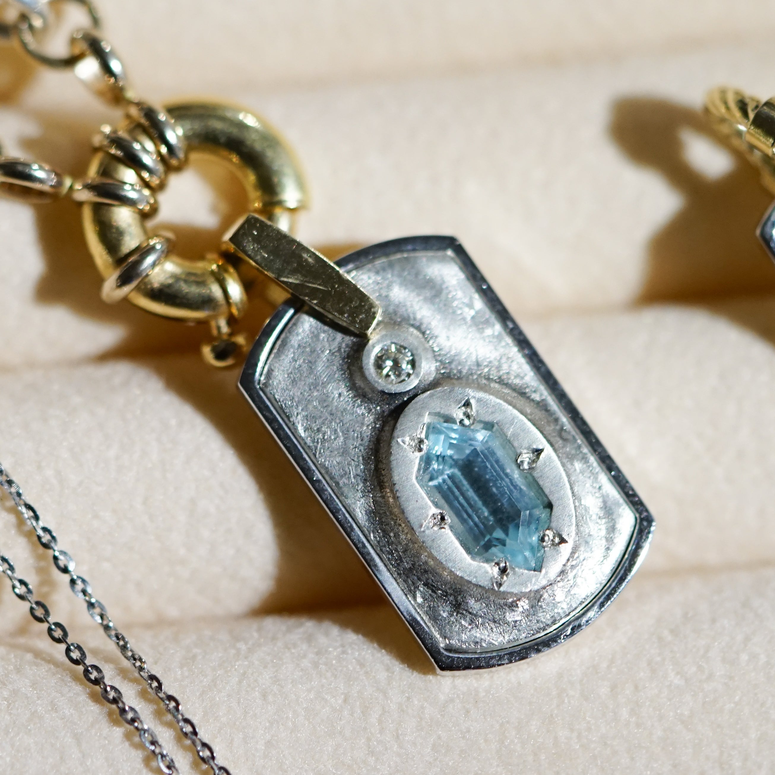 AURA MEDIUM TAG OVAL BLUE TOPAZ PLAIN BAIL AURA MEDIUM TAG OVAL BLUE TOPAZ PLAIN BAIL Miles McNeel Miles McNeel  Squash Blossom Vail
