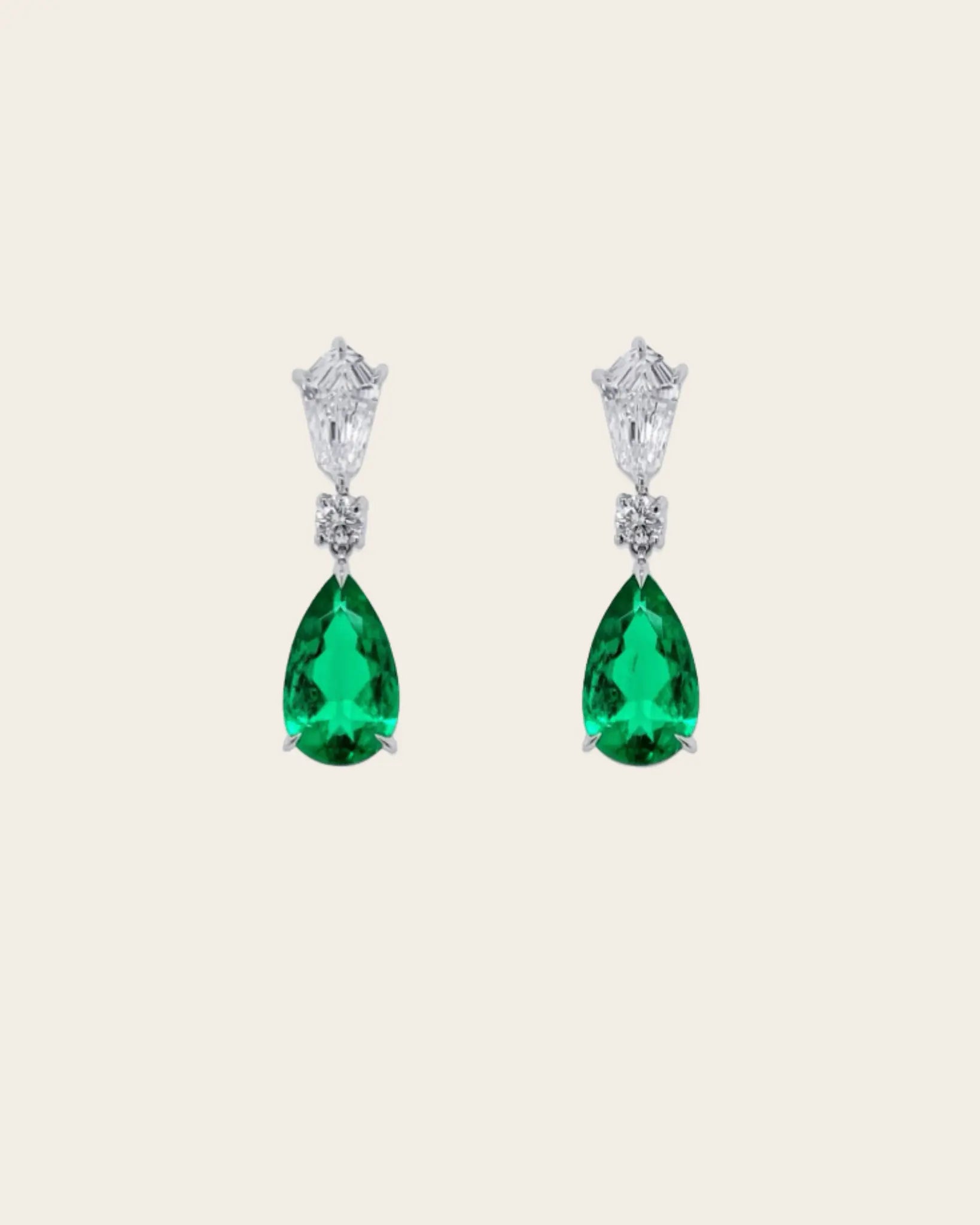 A pair of Bayco diamond & emerald teardrop earrings.