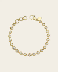 A gold diamond tennis bracelet by Single Stone.