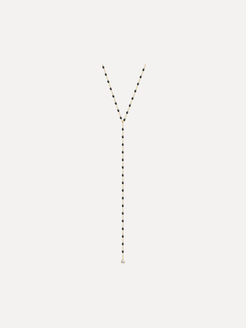 Long necklace with black and gold beads on a white background