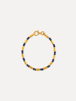 Gold bracelet with blue beads on a white background