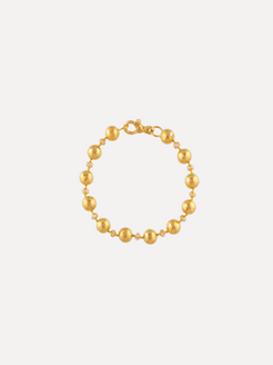 Gold bracelet with round beads on a white background