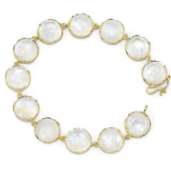 18K Gold bracelet with 11 mm rose cut moonstones. A great piece alone or a great stacking piece. Measures 7 inches long. Handcrafted hook and eye clasp with safety catch.  If an item is out of stock, please allow 4-6 weeks for delivery. Please email shop@sbvail.com for questions.
