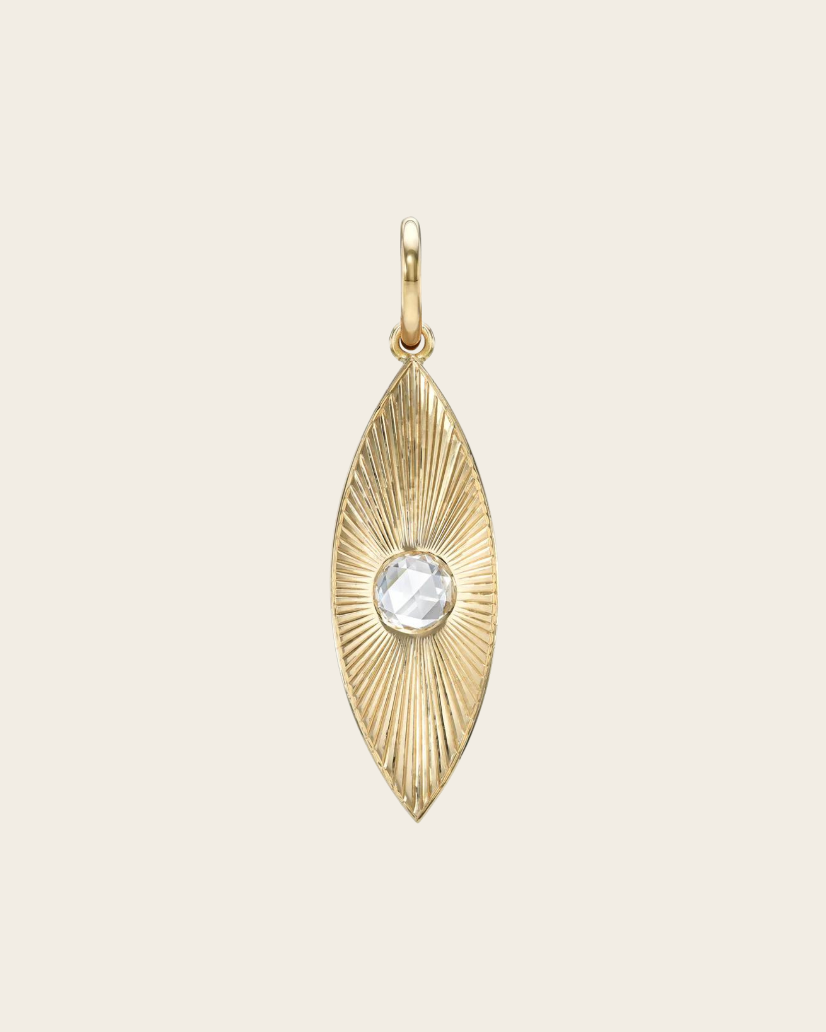 A NAYA gold pendant with a rose cut diamond.