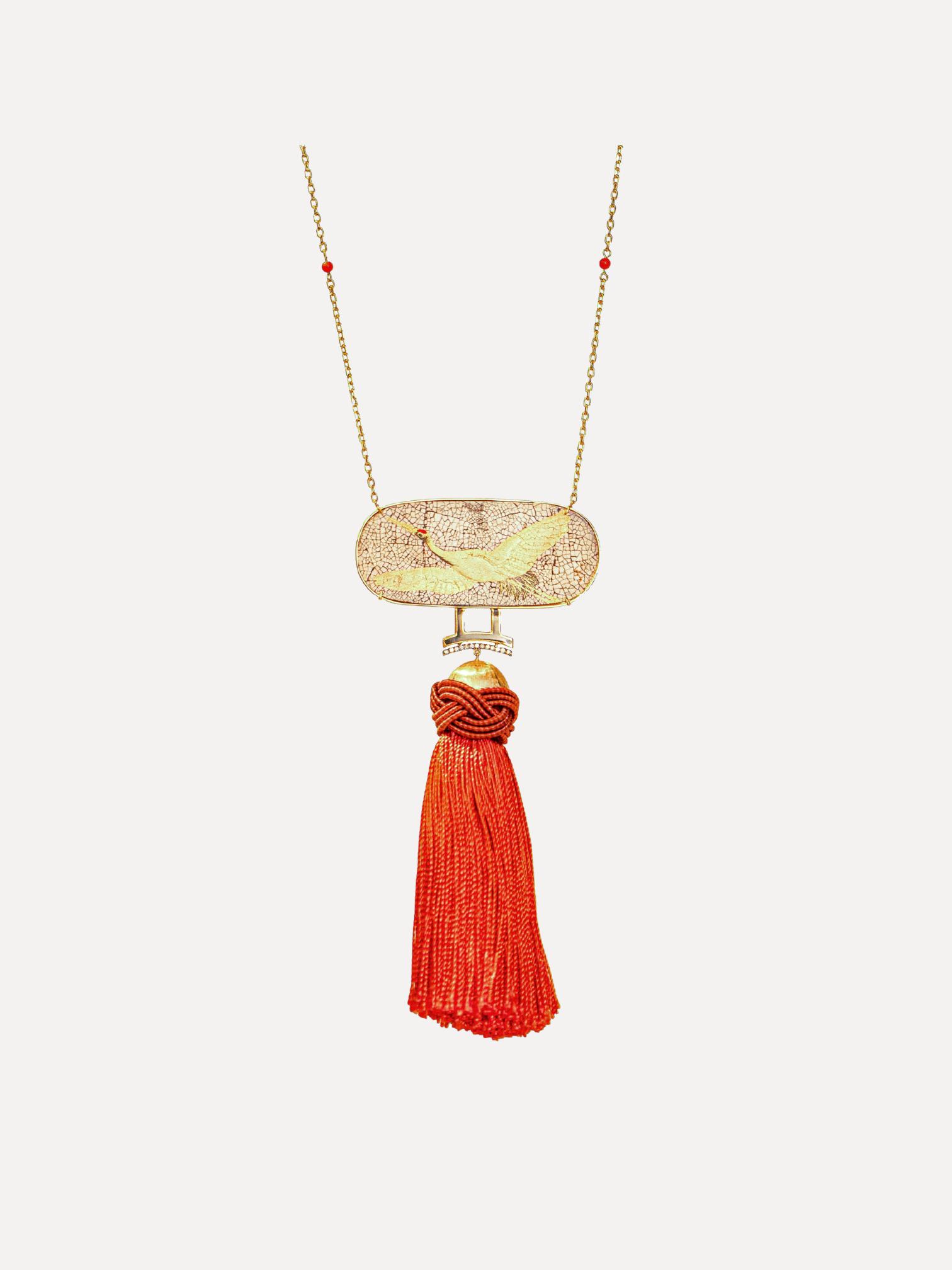 Necklace with coral and plate with bird pattern