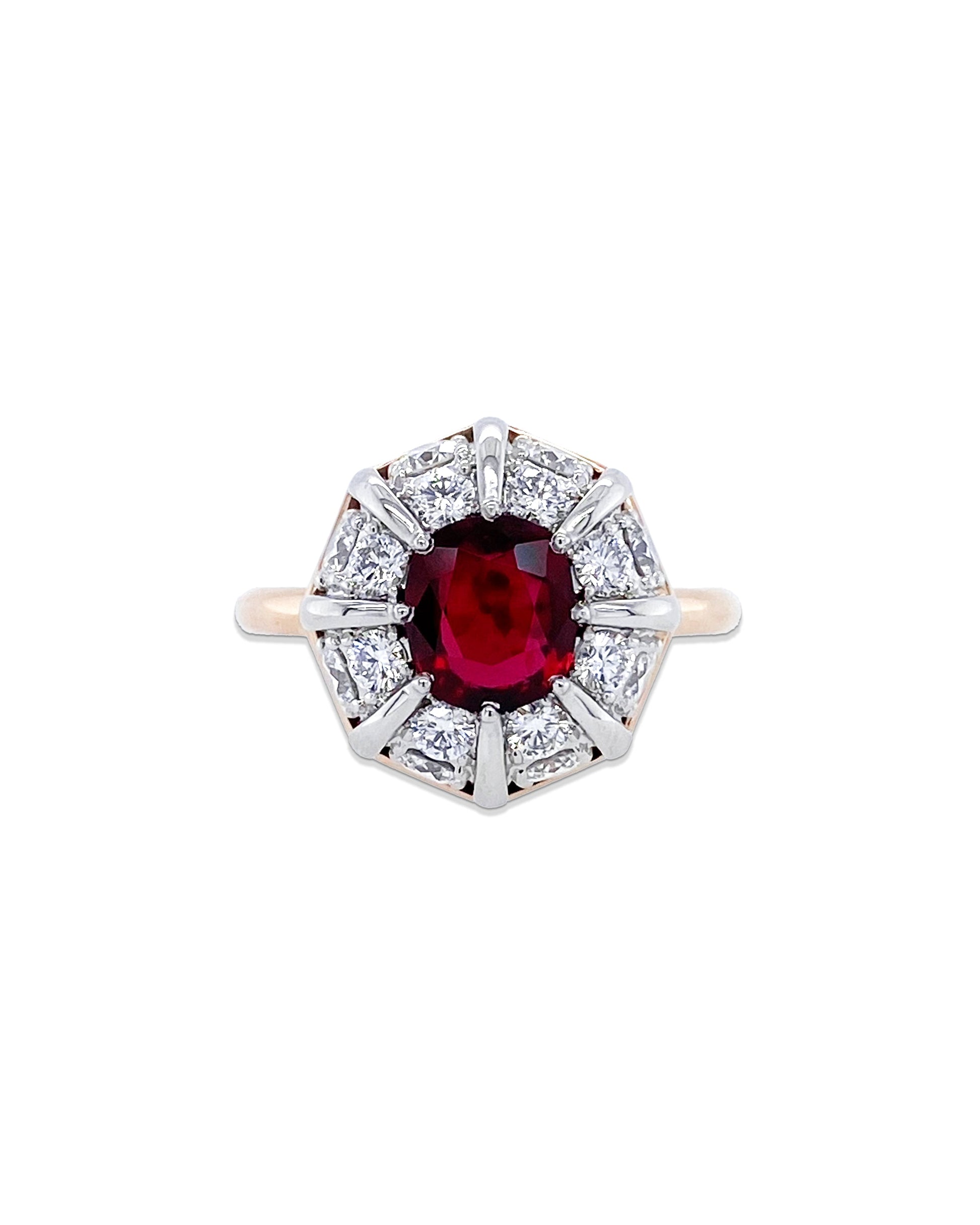 From Bayco's Collection, this beautiful Ruby Ring. A  platinum and 18k rose gold ring centered upon a cushion Thai ruby set atop a domed cluster of colorless diamonds. The ruby is 1.11 cttws and the brilliant white diamonds are 1.01 cttw. 