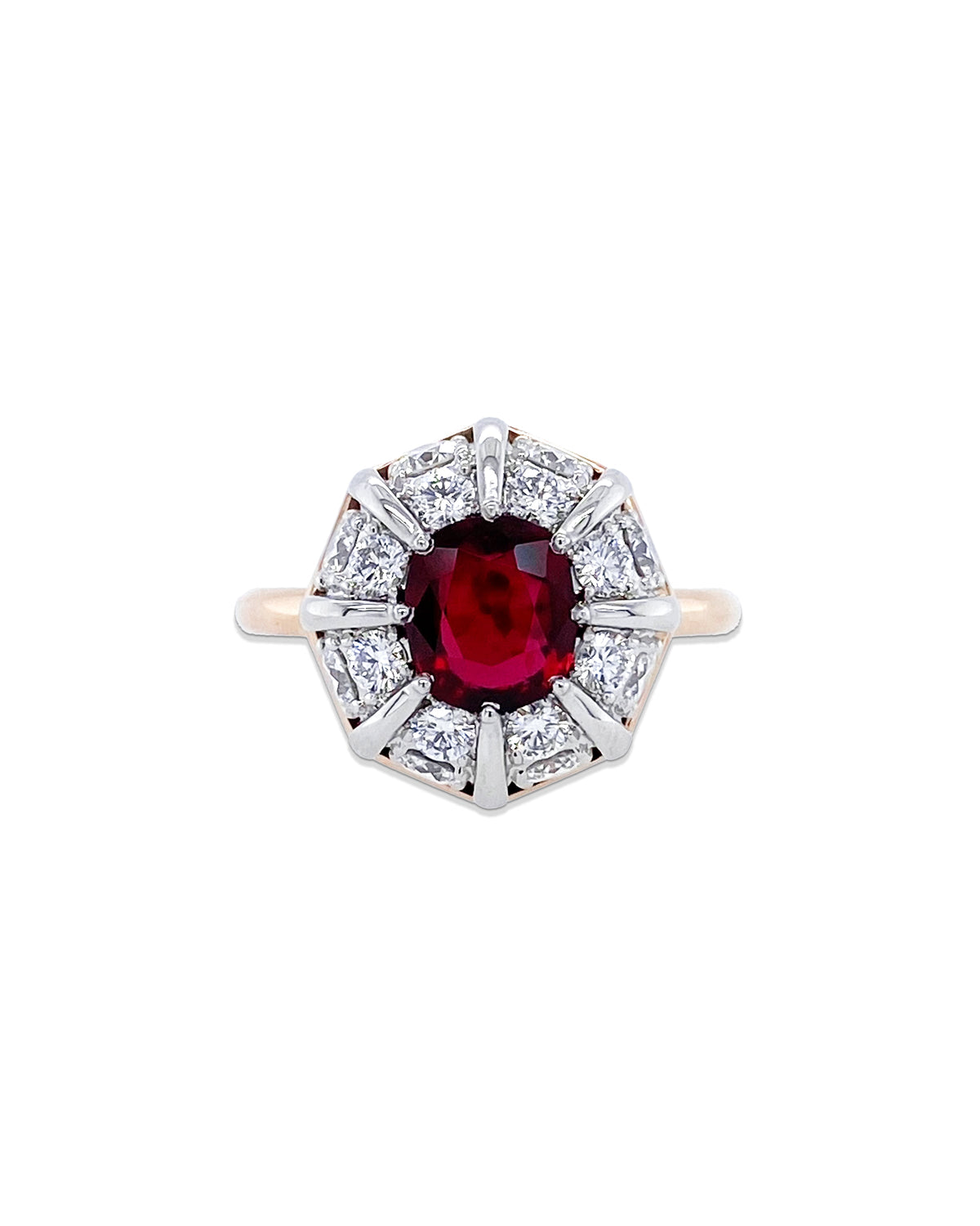 From Bayco&#39;s Collection, this beautiful Ruby Ring. A  platinum and 18k rose gold ring centered upon a cushion Thai ruby set atop a domed cluster of colorless diamonds. The ruby is 1.11 cttws and the brilliant white diamonds are 1.01 cttw. 