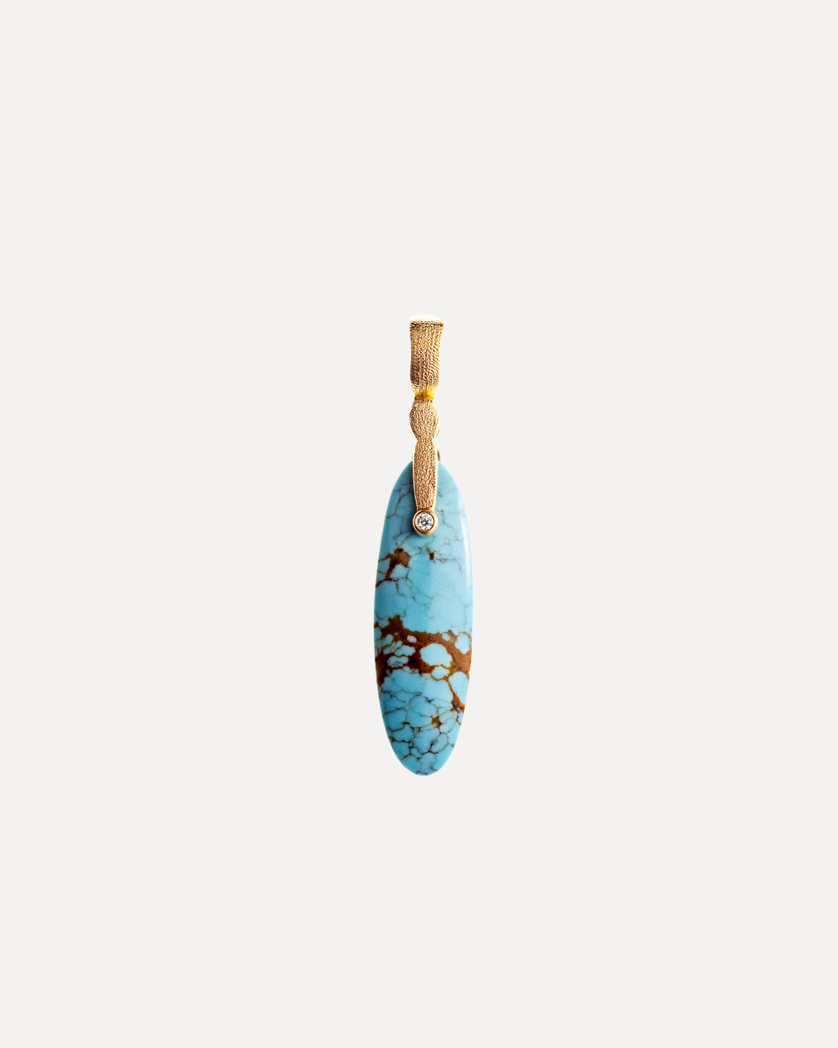 A gold & diamond turquoise pendant by Alex Sepkus.