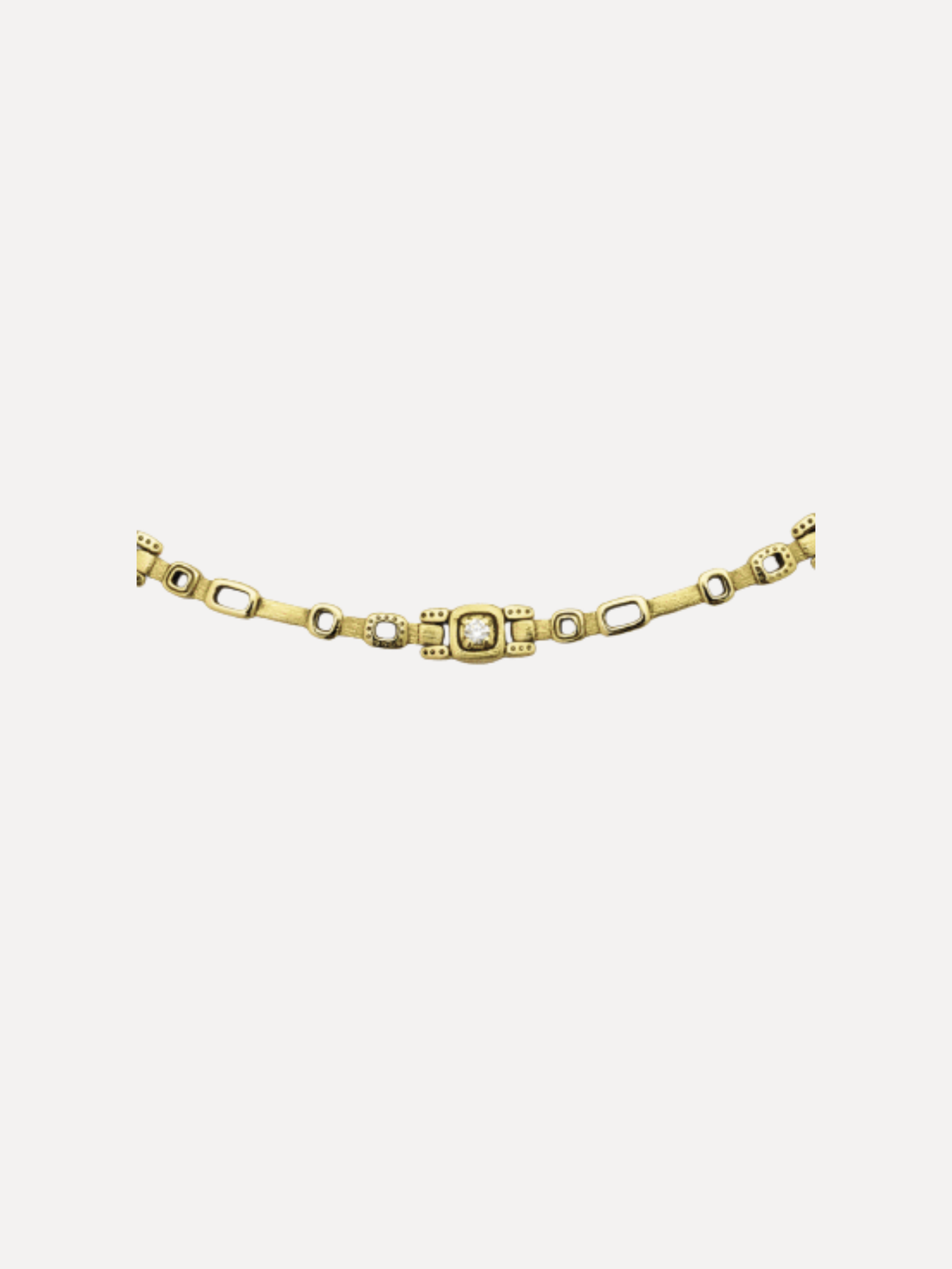 Alex Sepkus A gold-toned chain bracelet featuring a central rectangular link with a textured, diamond-like pattern, flanked by alternating elongated oval links and smaller round links, shown against a plain light gray background.