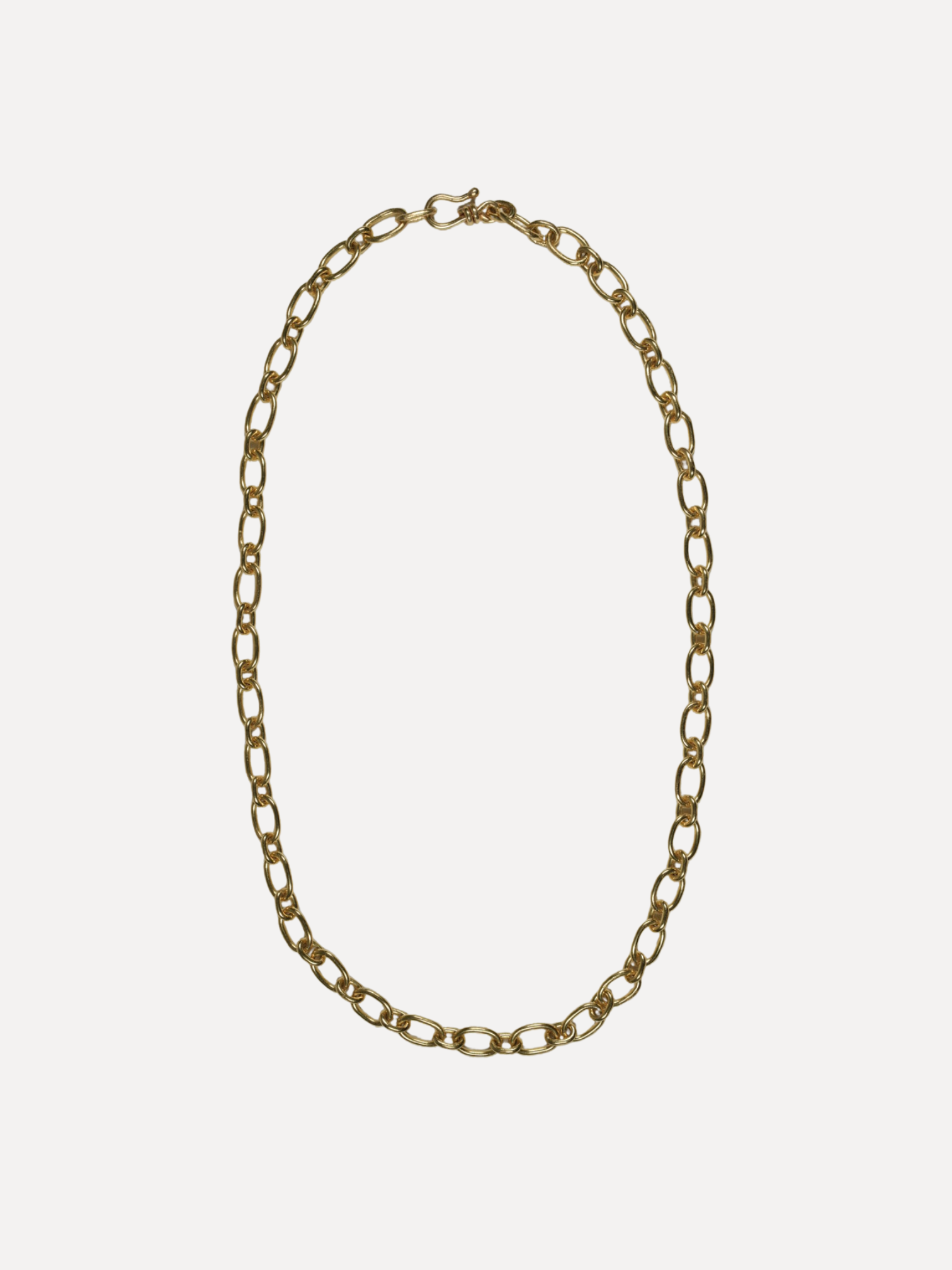 Gold chain necklace on a white background