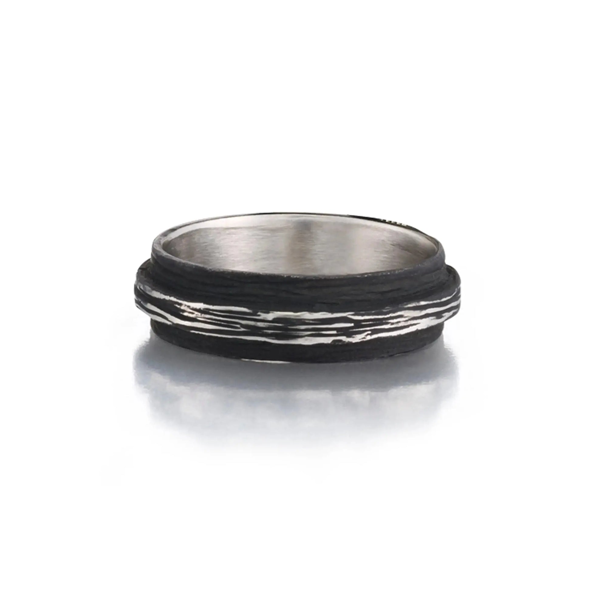 Pebble Raised Center Band in cobalt chrome 6.25mmPebble Raised Center Band in cobalt chrome 6.25mm  Ring Size: 10  If you need a different size, please email shop@sbvail.com  Designed by Sarah Graham Metalsmith