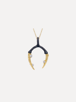 Gold and black pendant necklace on a white background