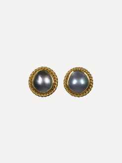Pair of gold-framed earrings with gray pearls on a white background