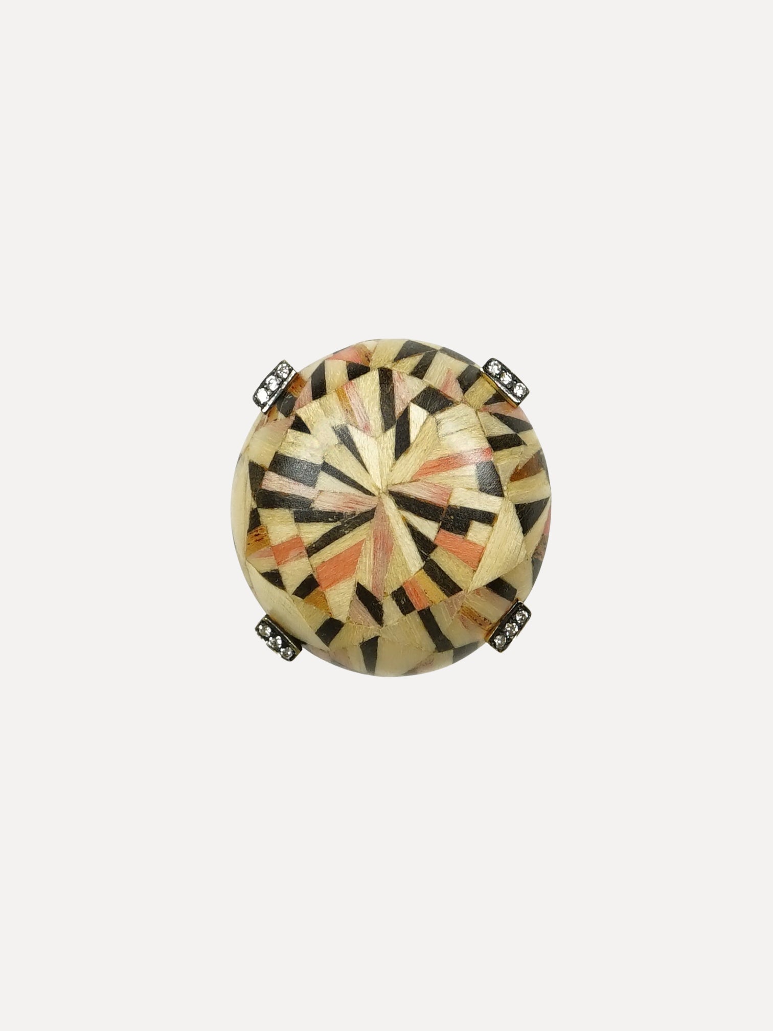 Decorative round object with geometric pattern on a white background