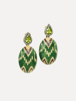 Pair of green and gold earrings with teardrop-shaped gemstones on a white background