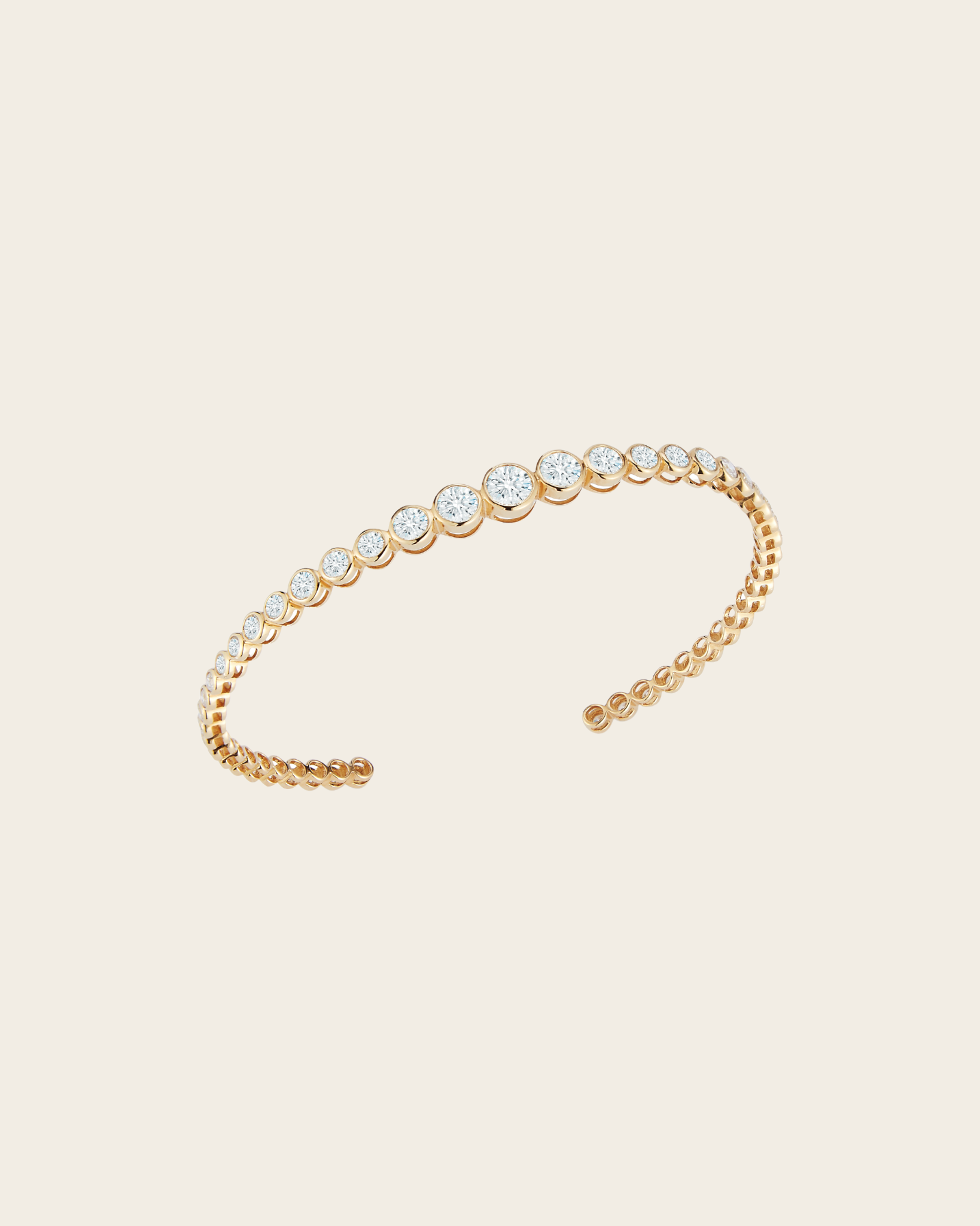 Inspired by the electric movement of light, diamonds ignite on your wrist with our single row Lumiére Bracelet.  Single row of bezel-set graduated diamonds, invisible side hinge, 18kt yellow gold  18kt Yellow Gold 2.76 Total Diamond Carat Weight SI / H Min. Diamond Quality Handmade in Thailand
