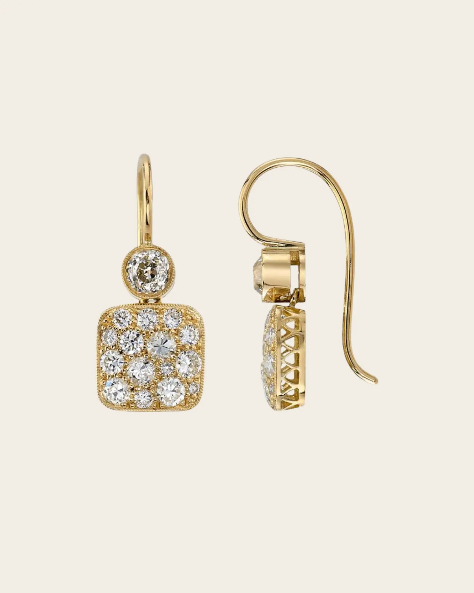 A pair if fish hook Single Stone gold diamond double drop earrings by Single Stone.