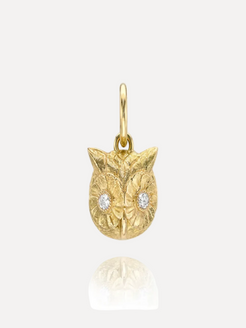 Gold owl pendant with diamond eyes on a white background