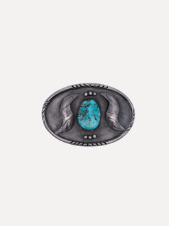 Silver belt buckle with a turquoise stone on a white background