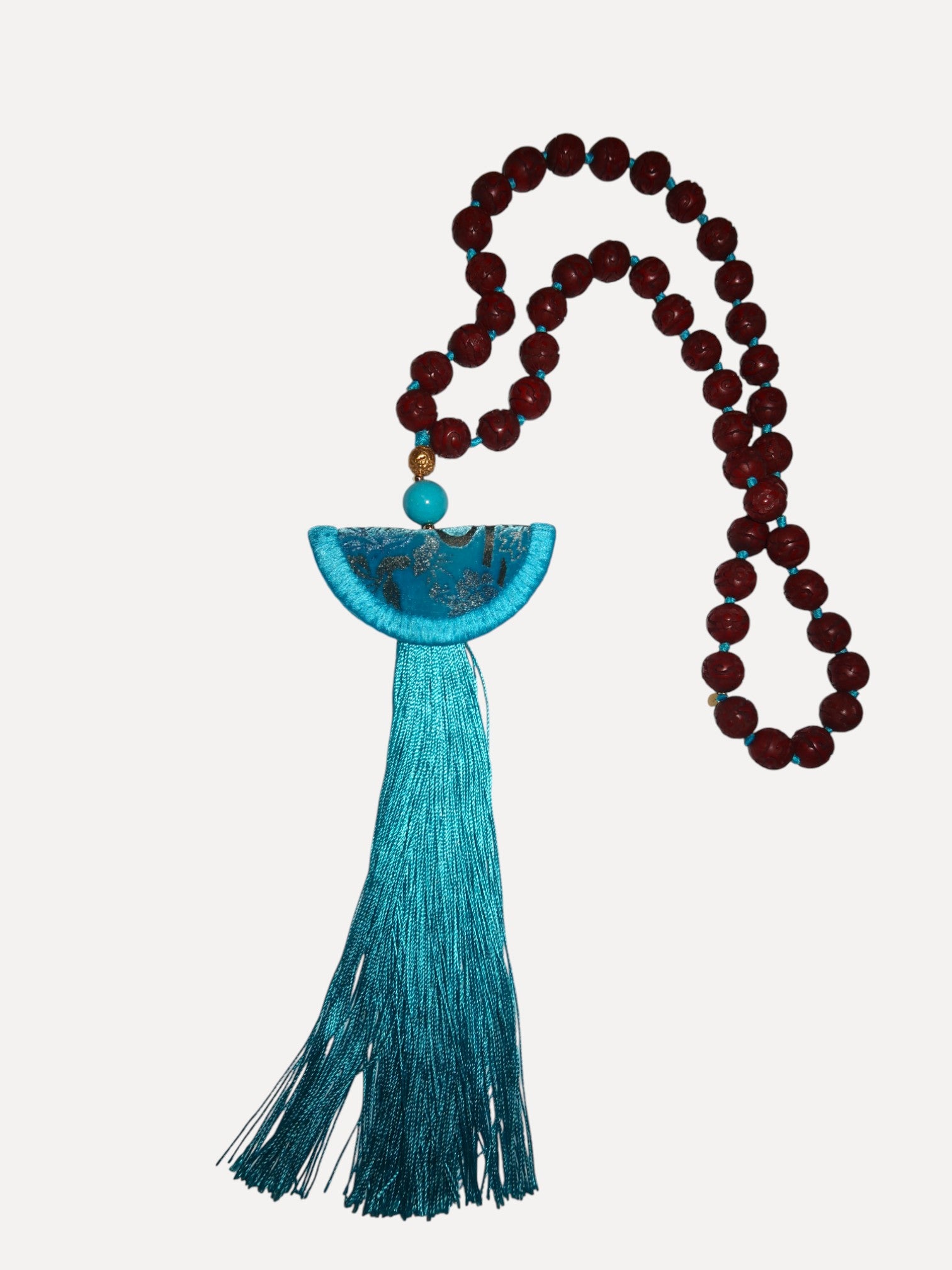 Turquoise Venetian silk necklace with half moon format, tassel and cinnabar Turquoise Venetian silk necklace with half moon format, tassel and cinnabar Silvia Furmanovich Silvia Furmanovich  Squash Blossom Vail