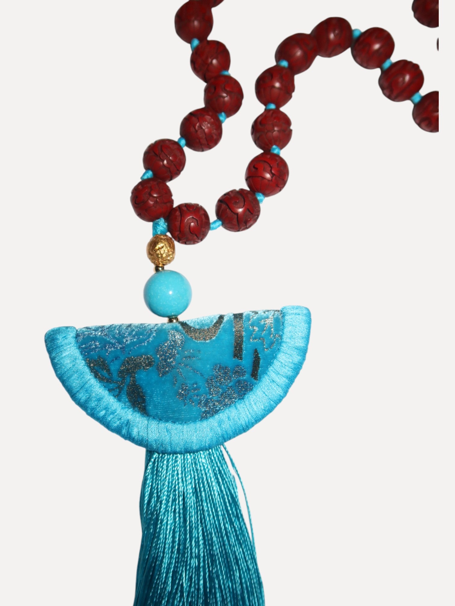 Turquoise Venetian silk necklace with half moon format, tassel and cinnabar Turquoise Venetian silk necklace with half moon format, tassel and cinnabar Silvia Furmanovich Silvia Furmanovich  Squash Blossom Vail