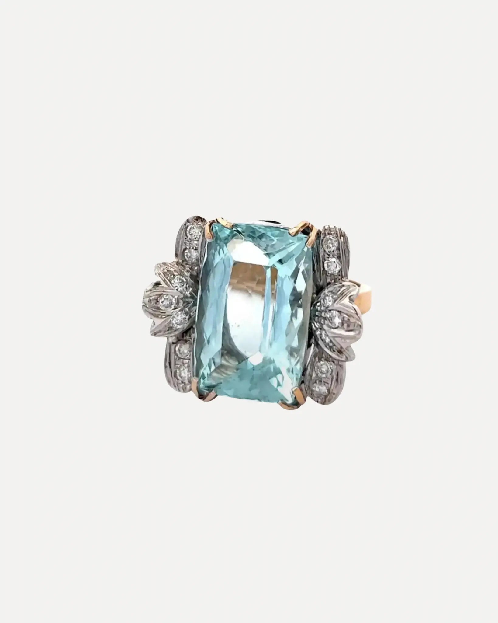 A aquamarine & diamond ring by Squash Blossom.