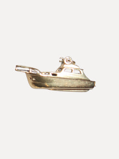 Gold boat-shaped pendant on a white background