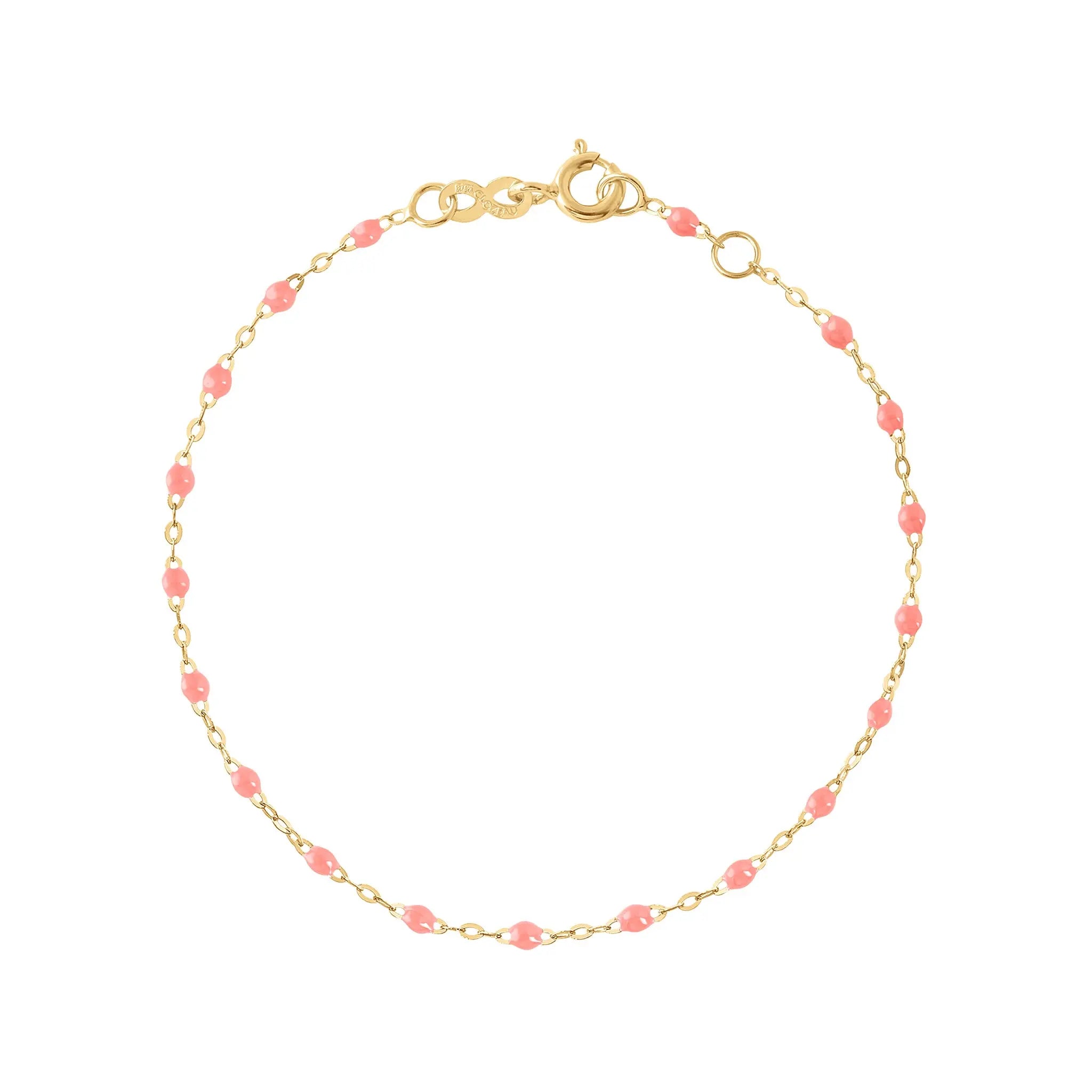 The Classic Gigi bracelet by gigi CLOZEAU features 18K Yellow Gold, and unique Fushsia jewels for a simple, everyday look.   Each jewel is unique, artisanally made in their family-owned workshop. 18K yellow gold and resin. The bracelet measures 6.7 inches with adjustable clasp at 6.3 inches.