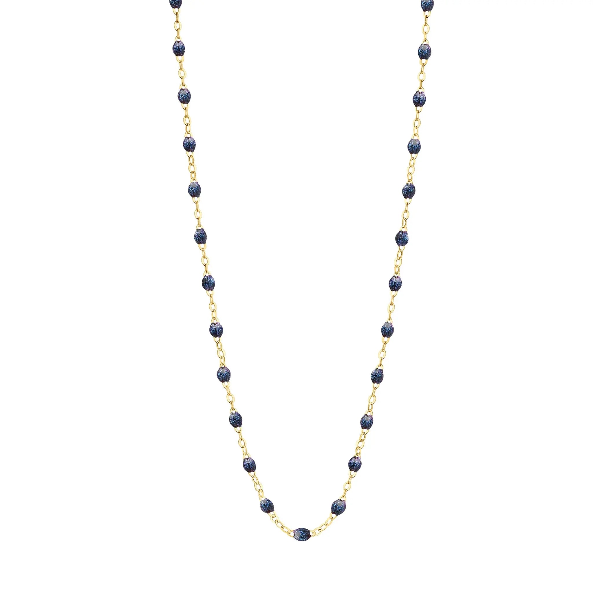 Stack you necklace layers with this versatile beaded chain! The Classic Gigi Necklace by gigi CLOZEAU features 18 carat yellow gold, and striking Midnight resin jewels for an everyday effortless appearance. Handcrafted in 18k yellow gold. The beads measure 1.50mm in diameter and is finished with a spring ring clasp. The length is 19.7 inches.