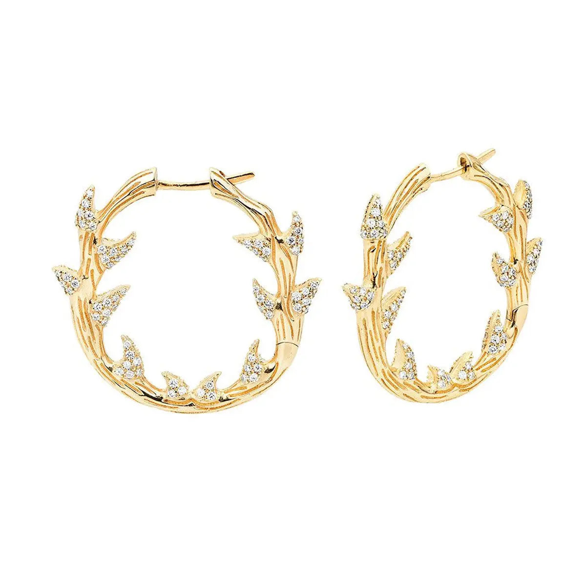 18k hinged hoops with 15 grams plus of gold and almost a carat and a half of diamonds in an intricate and edgy hoop design.  Designed by Feral Jewelry